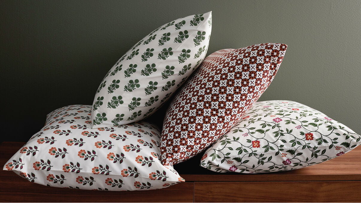 Images of pillows in artisan-inspired prints